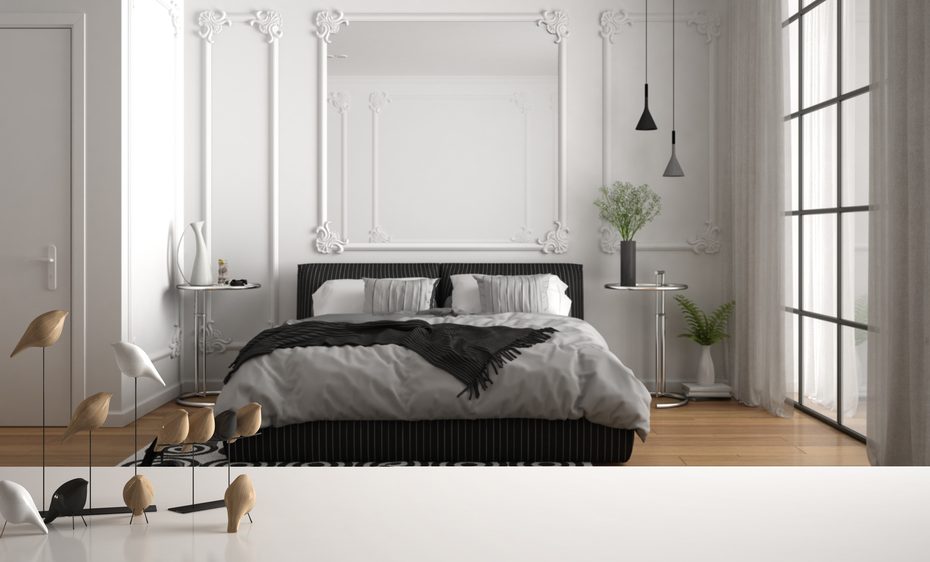 White table top or shelf with minimalistic bird ornament, birdie knick - knack over blurred classic luxury bedroom with double bed, parquet and decors, contemporary interior design